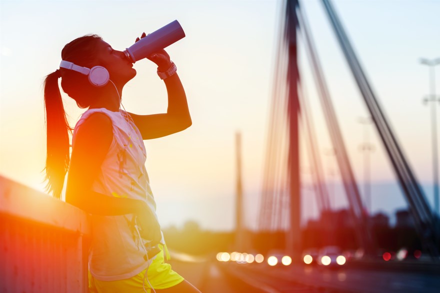 girl drinking electrolyte drink