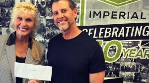 Lisa and Michael giving donation