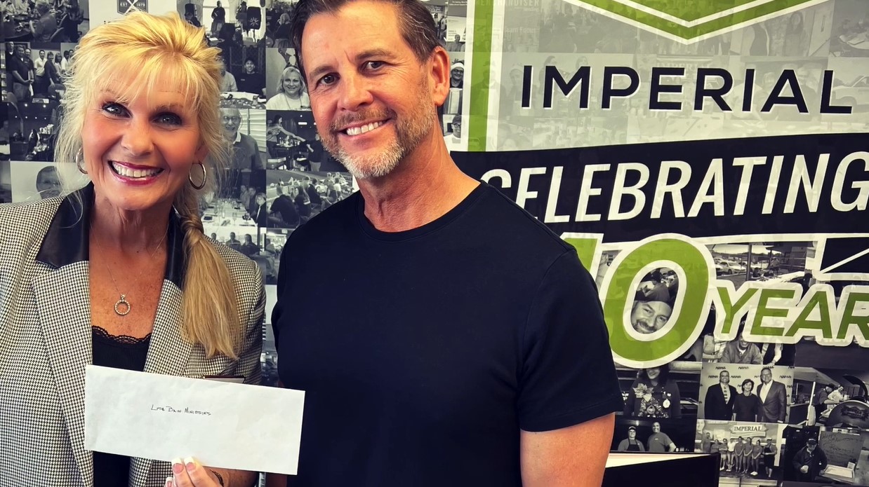 Lisa and Michael giving donation
